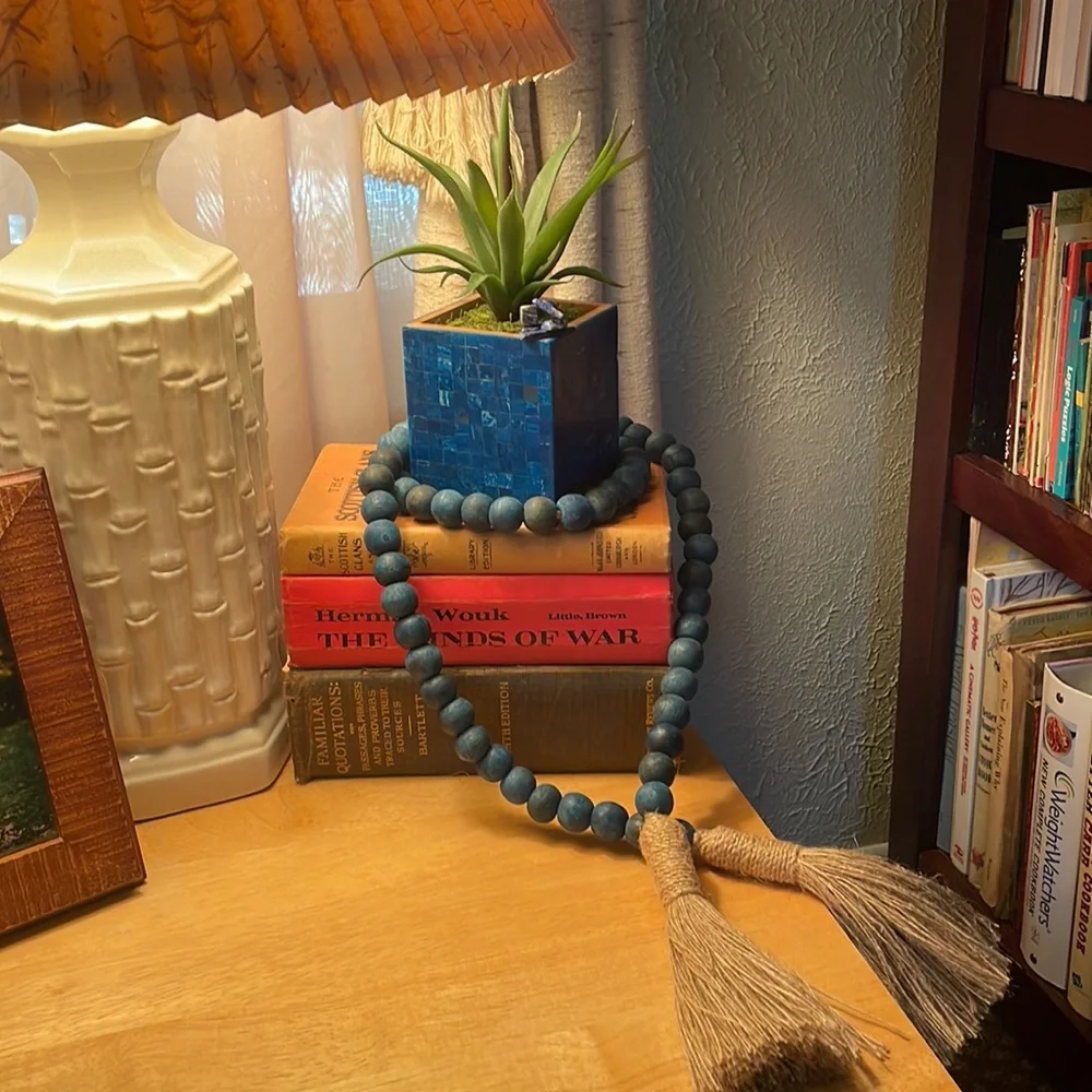 Faux succulent in deep blue dyed shell mosaic cube.